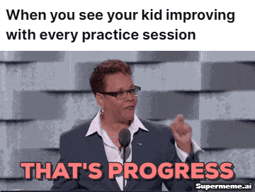 A woman with glasses is using a microphone speaking "That's progress", with a caption that says "When you see your kid improving with every practice session."